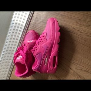 Nike Air Max 90s fuschia color.